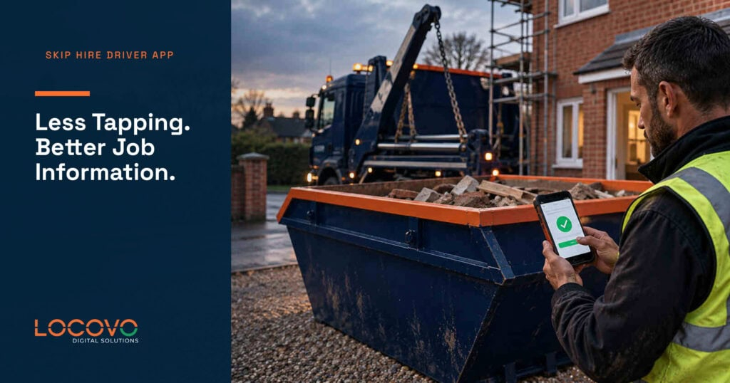 Driver checking job information on a phone beside a skip at a building site.