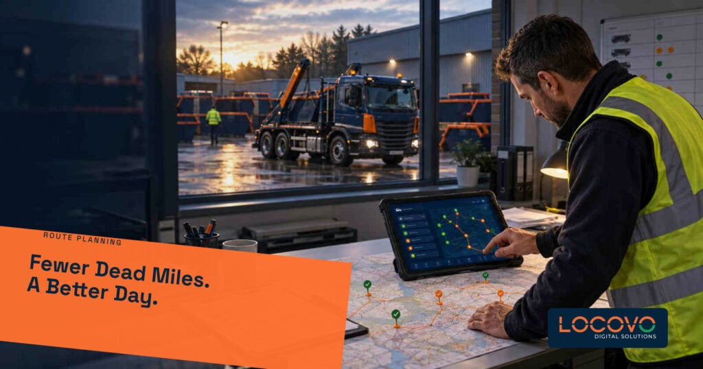 Transport manager planning skip delivery routes on a tablet beside a yard window.